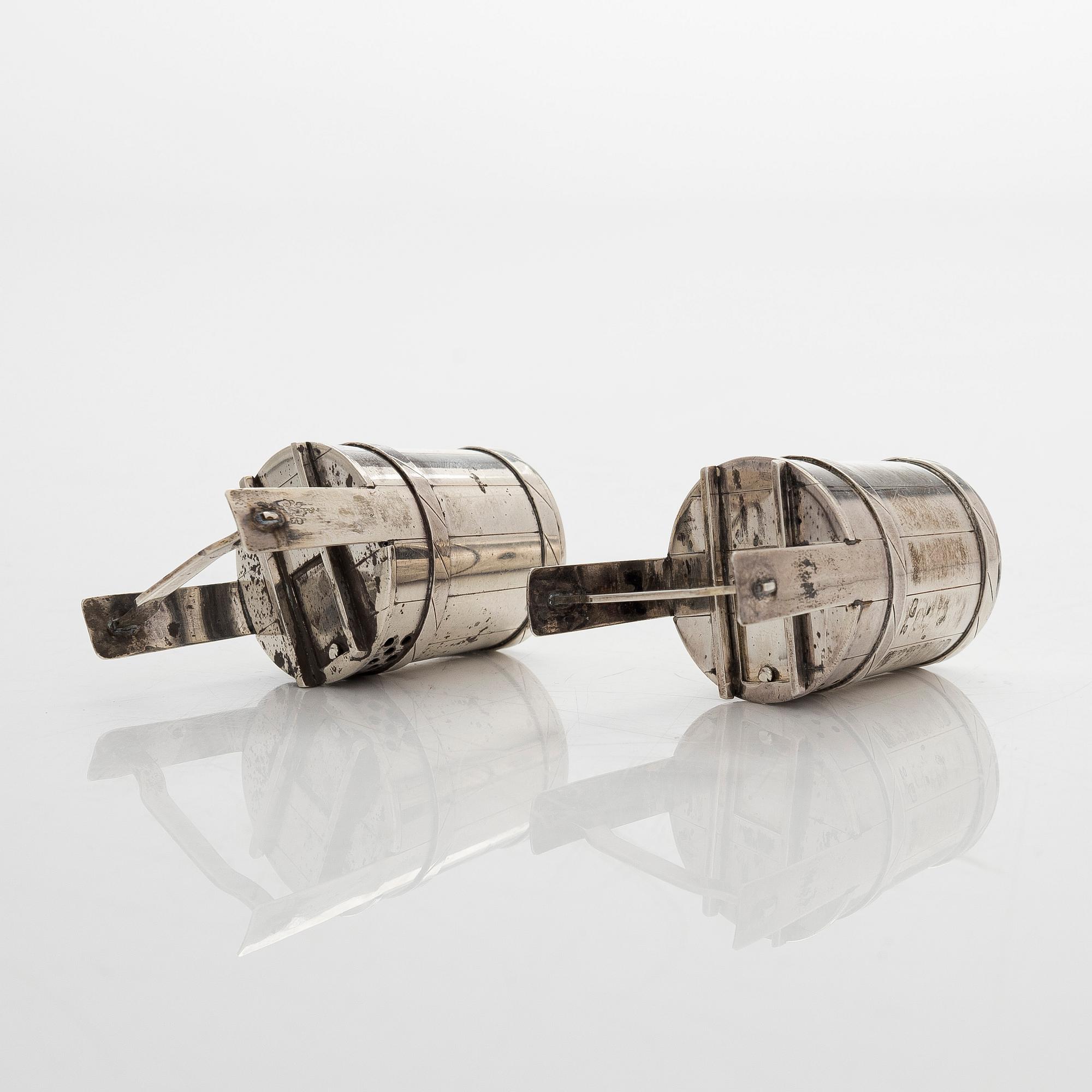 A pair of sterling silver salt- and pepper shakers , Japan, latter half of the 20th century.