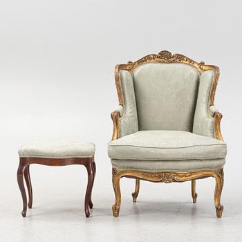 A Rococo-Style bergère easy chair, first half of the 20th Century.