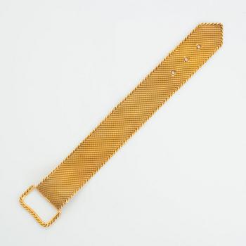 Armband 18K guld i form av ett bälte.