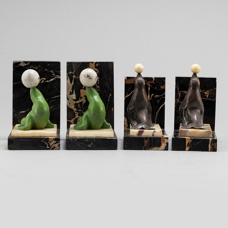 Two pairs of 20th century Art Deco bookstands decorated with sealions.