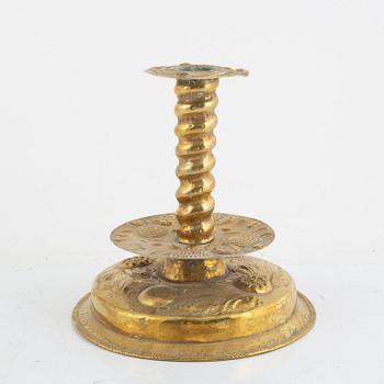 A Swedish repousse-brass baroque candlestick, circa 1700.