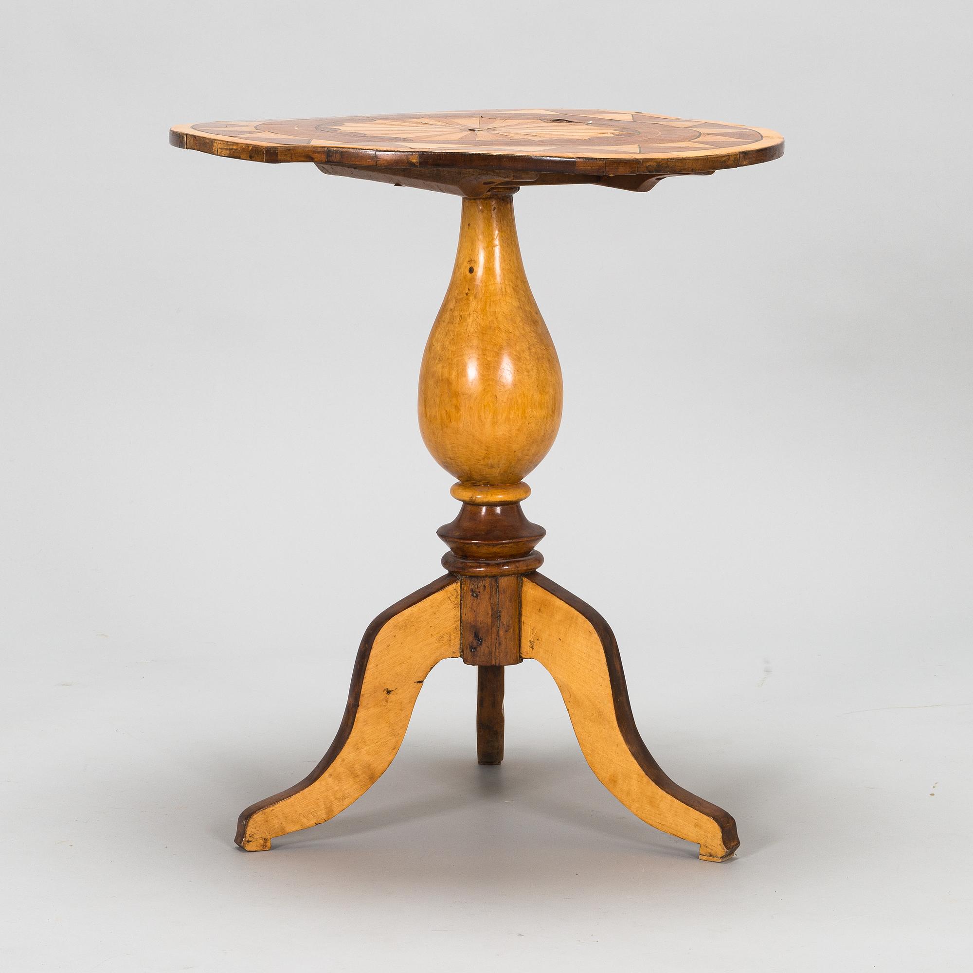 A tilt top table from 19th Century.