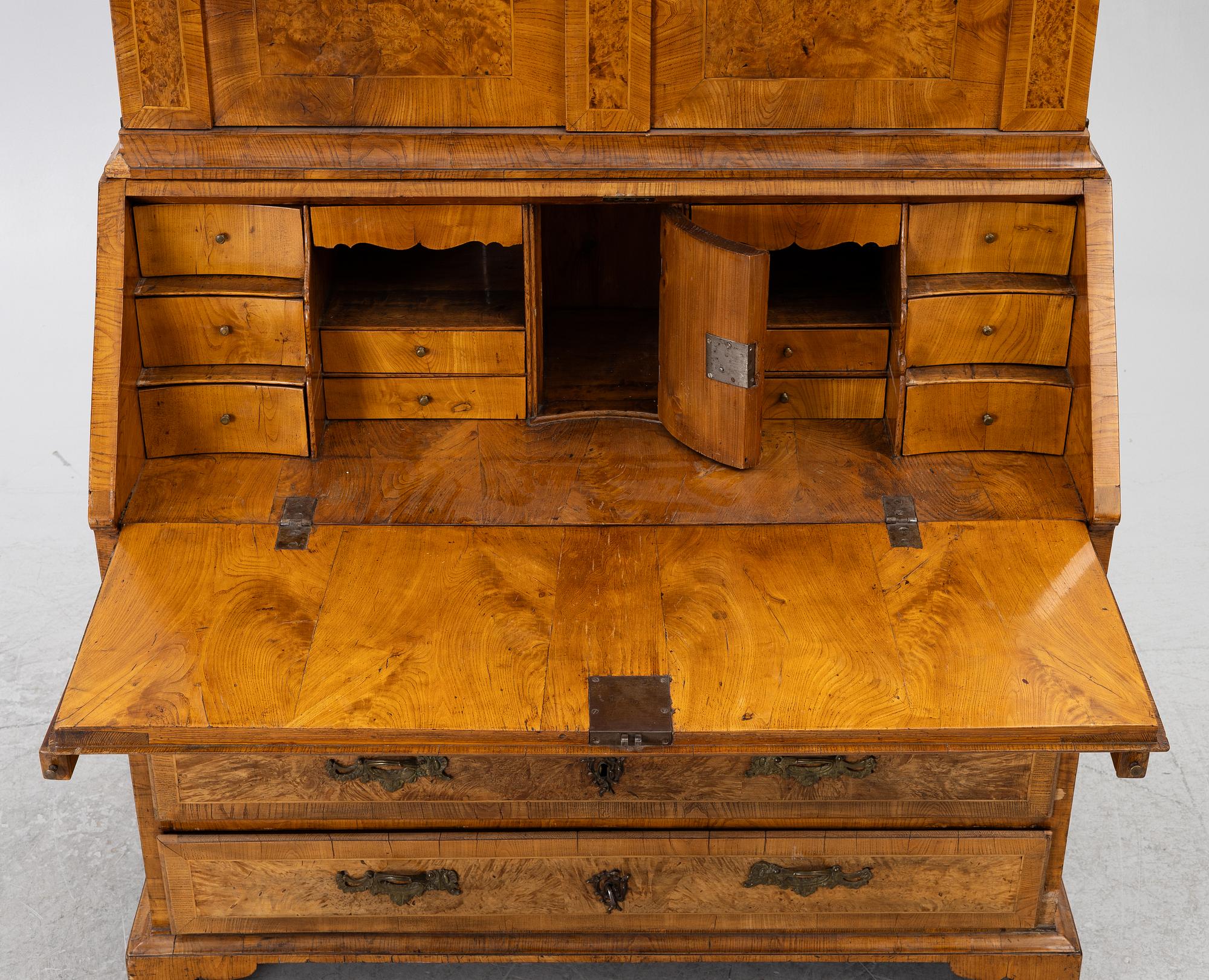 A Swedish rococo burr-alder veneered cabinet, later part 18th century.
