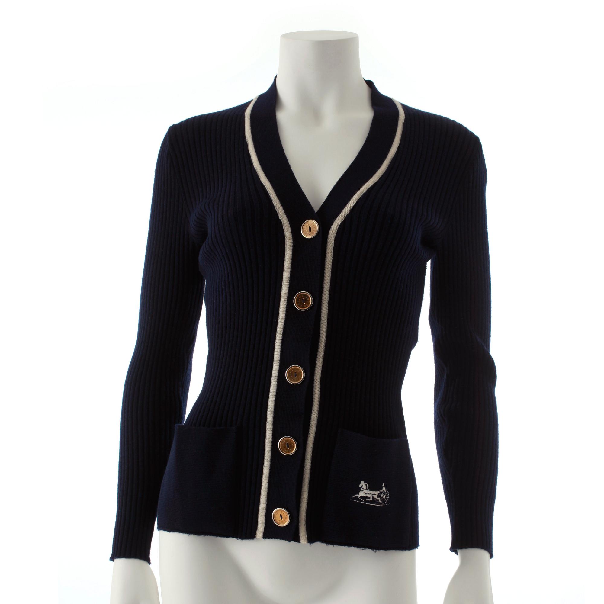 CÉLINE, a navy blue cardigan.