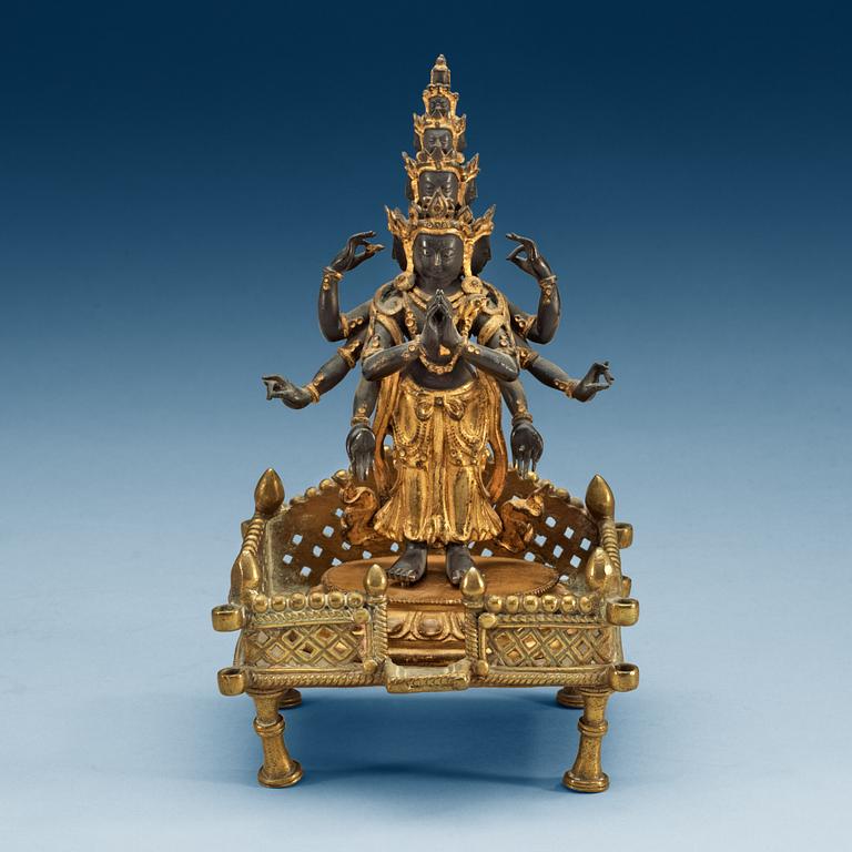 A gilt bronze figure of eleven-faced Avalokiteshvara, Tibet/Nepal, 19th Century.