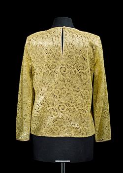A 1990s golden blouse by Yves Saint Laurent.