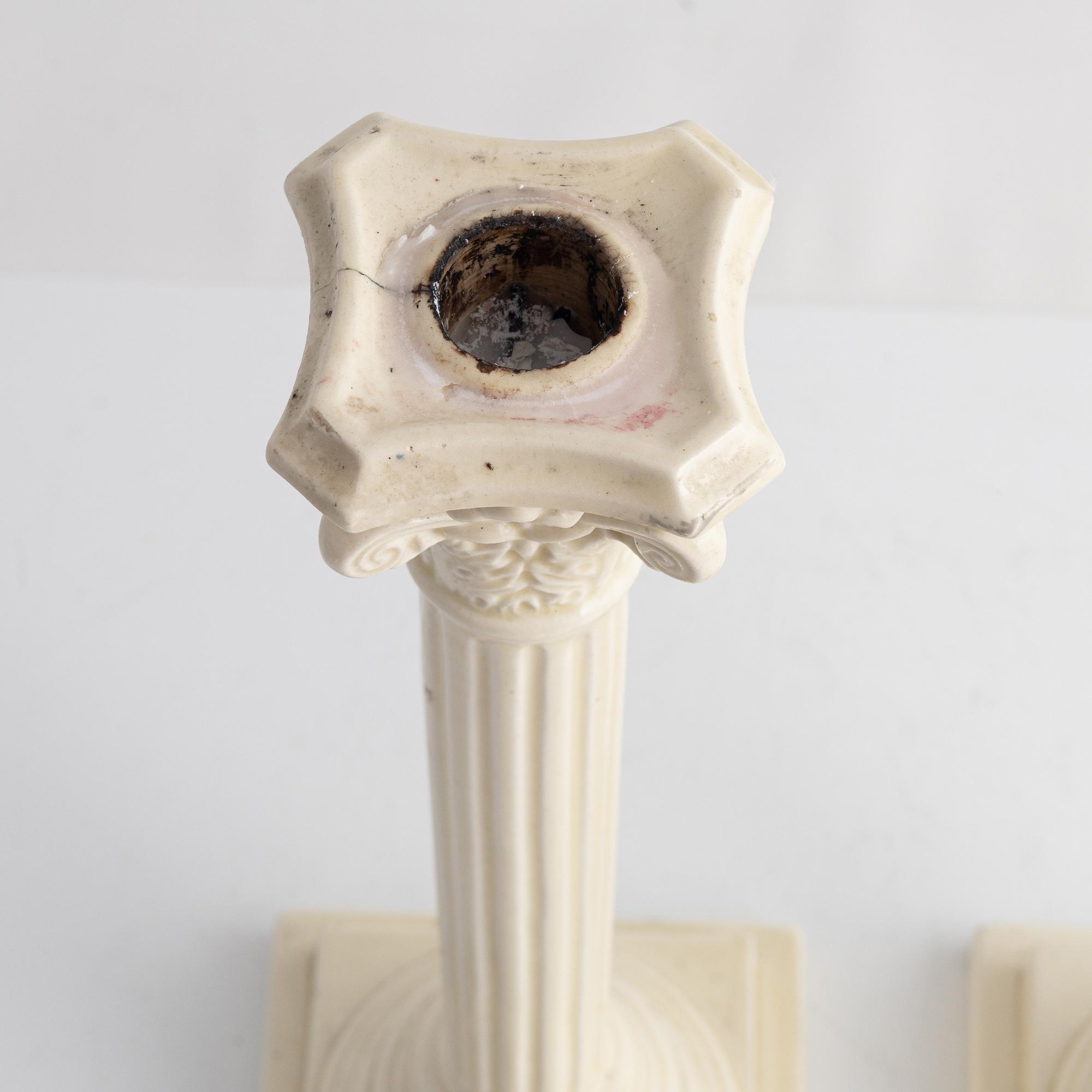 A pair of creamware candlesticks, around 1900.