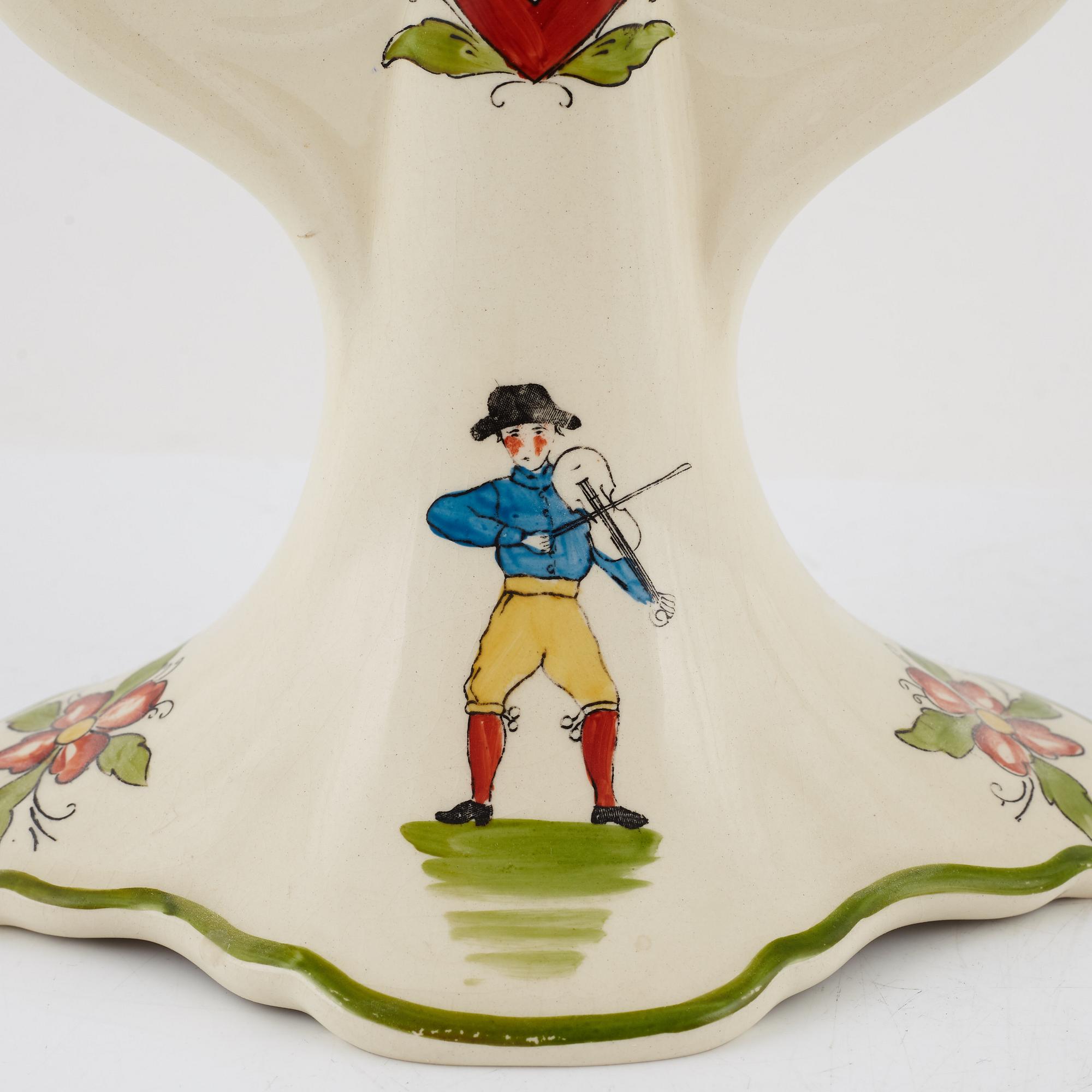 A pair of 'Daladansen' creamware candelabra from Rörstrand, Art Nouveau, early 20th Century.