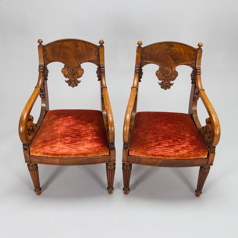 A pair of Baltic open armchairs from around 1820.