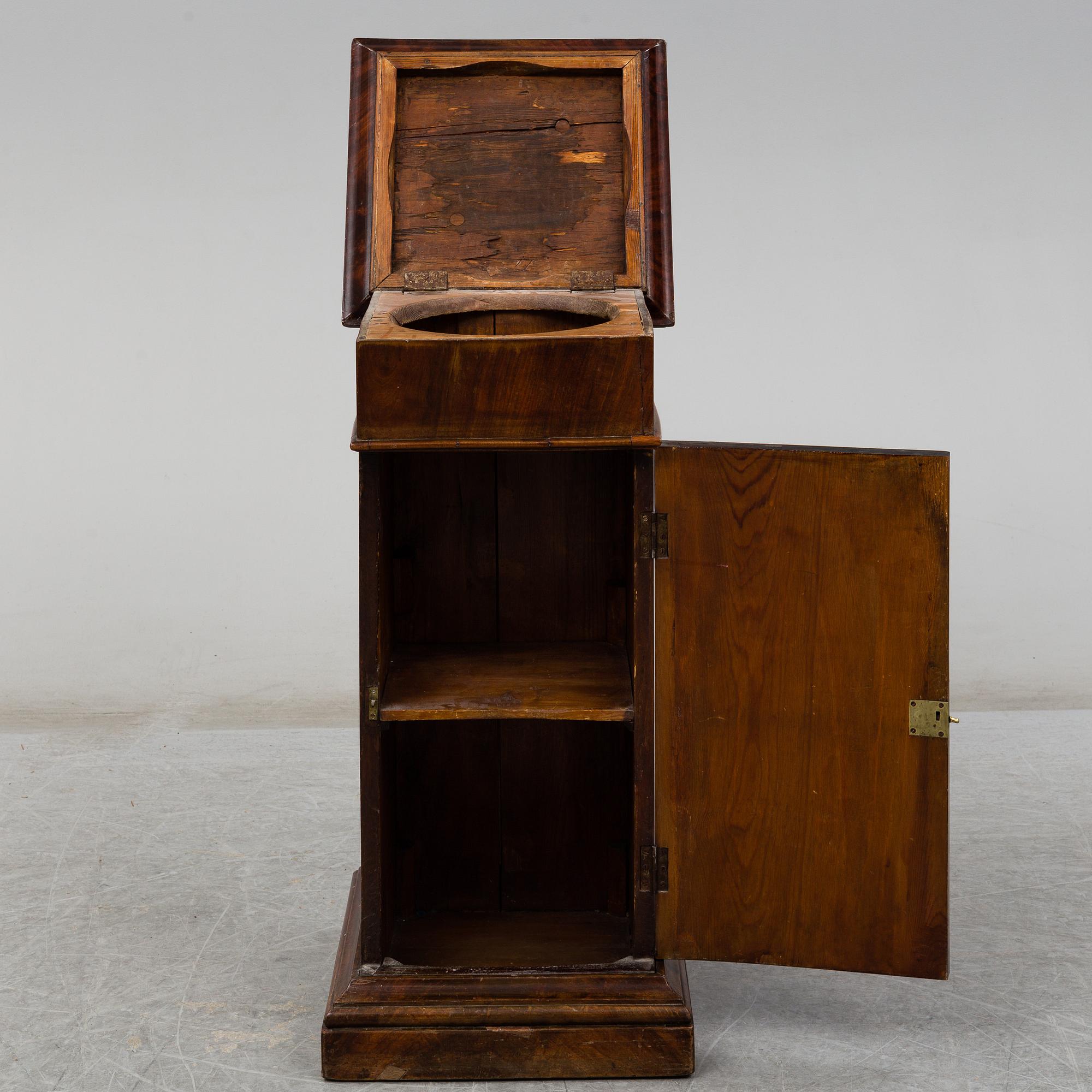 A Swedish Empire bedside table, early 19th century.