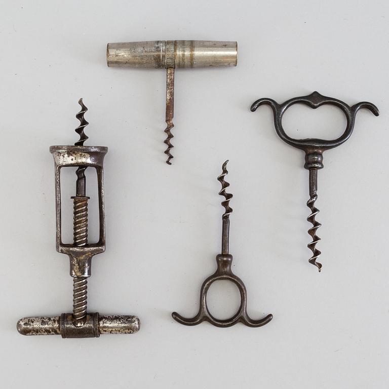 FOUR CAST IRON CORK SCREWS, 19th century.