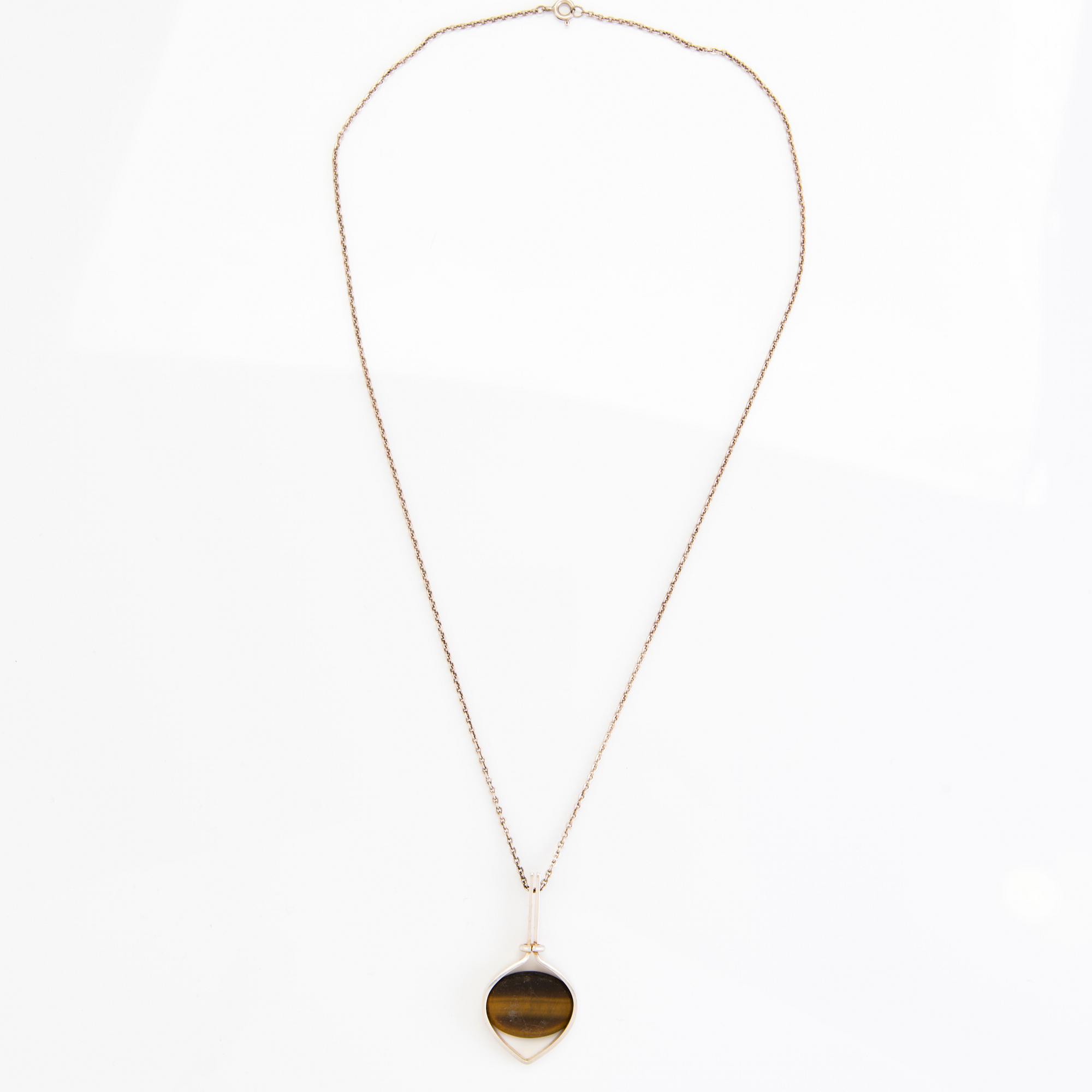 RIIPUS ja SORMUS, hopeaa, tiikerinsilmä, 1961.