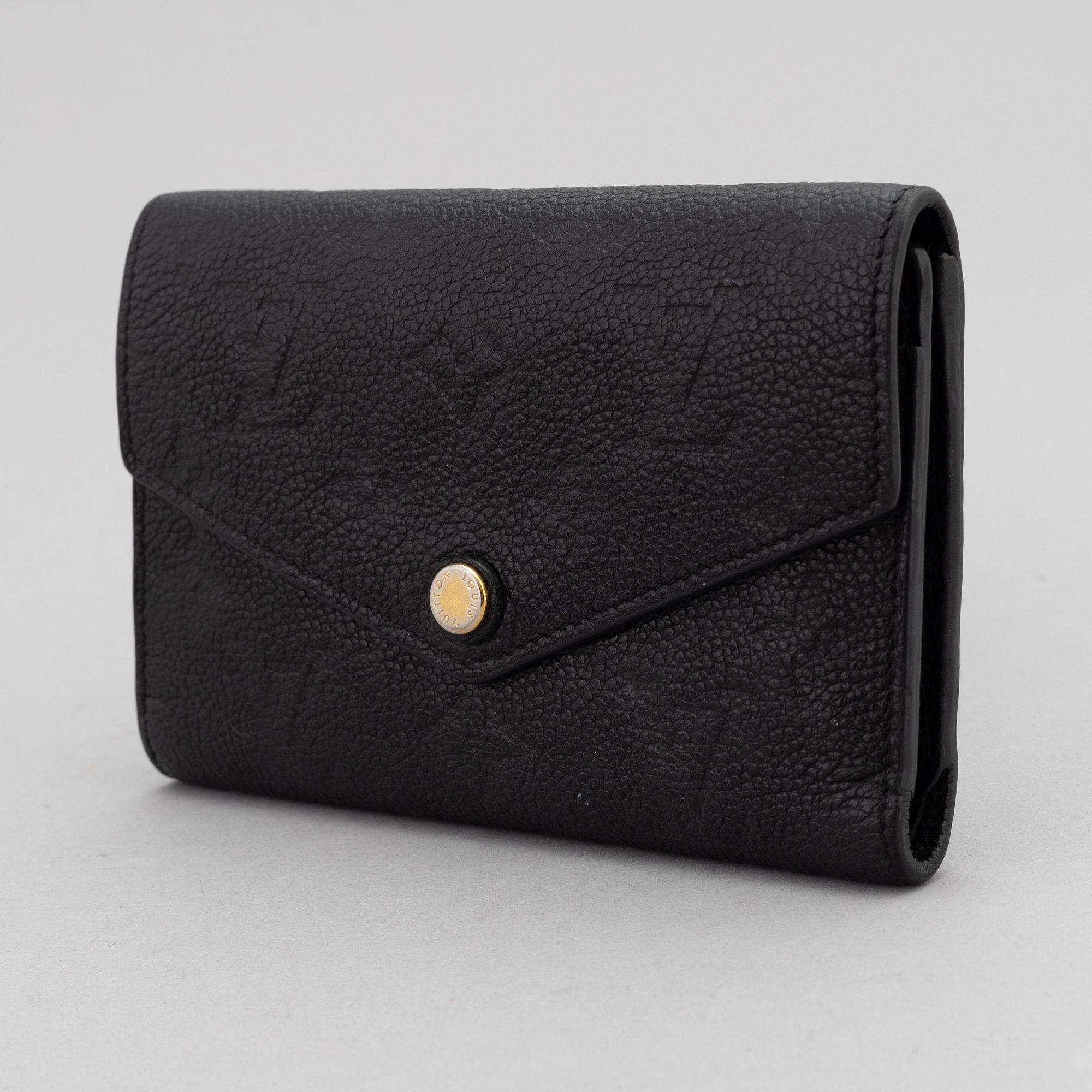 Louis Vuitton, a black Monogram Empreinte leather 'Curieuse' wallet, 2015.