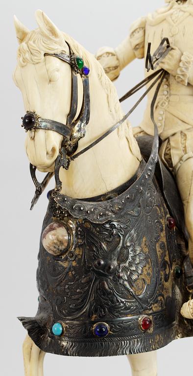 A late 19th century equestrian ivory, wood and metal statue.