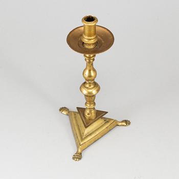 A bronze candlestick, 17th/18th century.