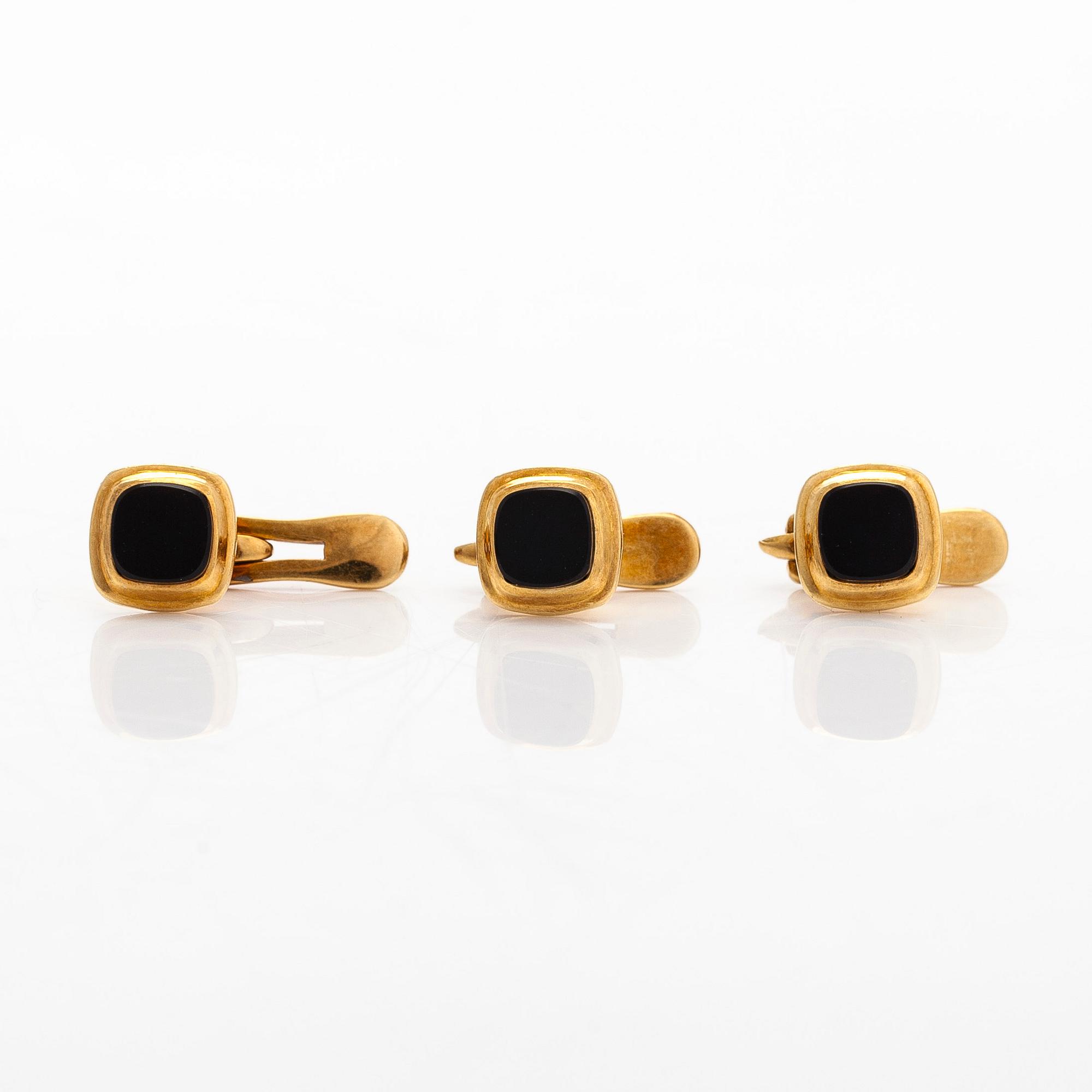 A pair of cufflinks and three shirt buttons,  18K gold and onyx.