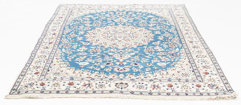 A Nain carpet, circa 310 x 196 cm.