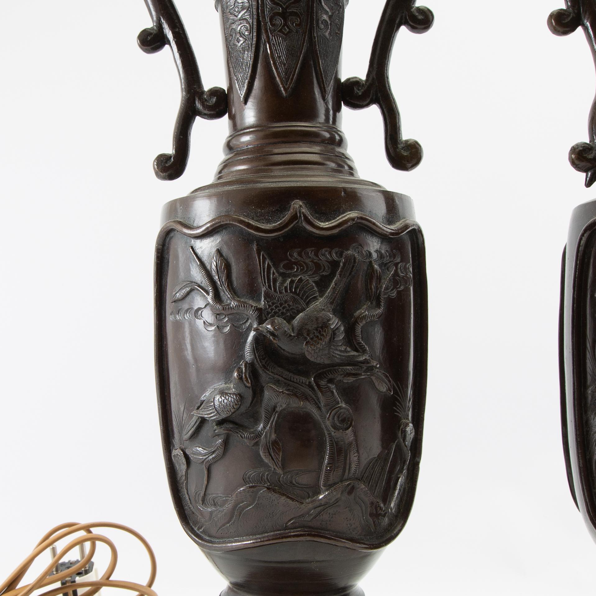 Table lamps a pair China 20th century patinated metal.