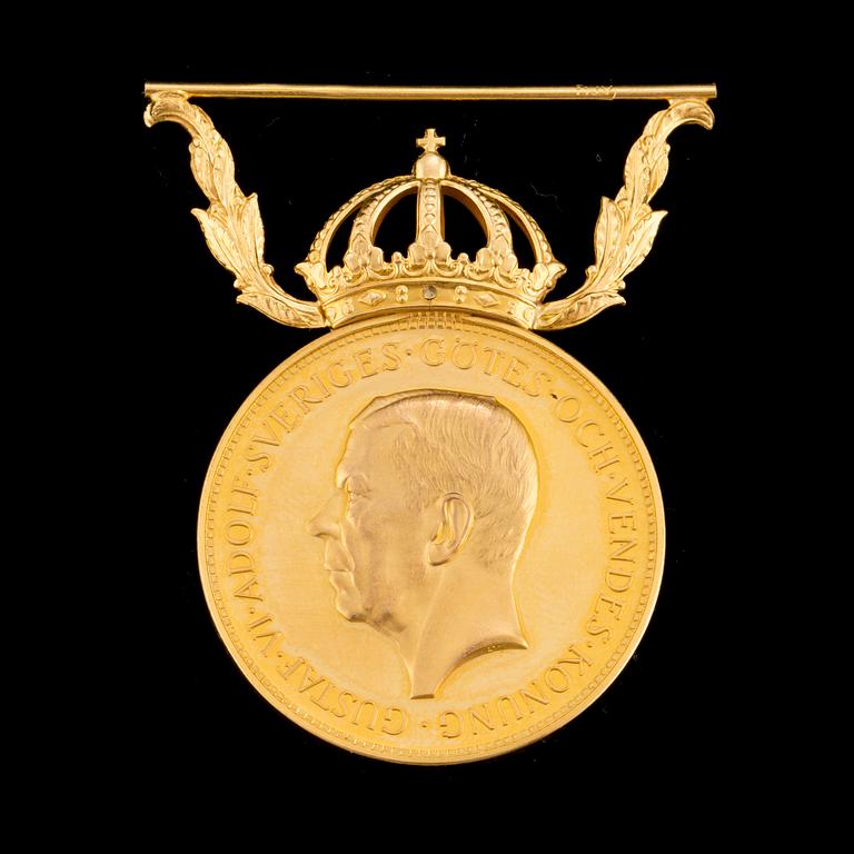 a gold medal 18 k, weight 13 g.