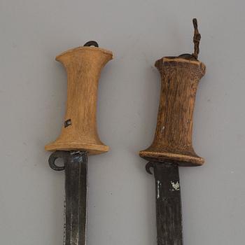 Two 20th century sickle swords.