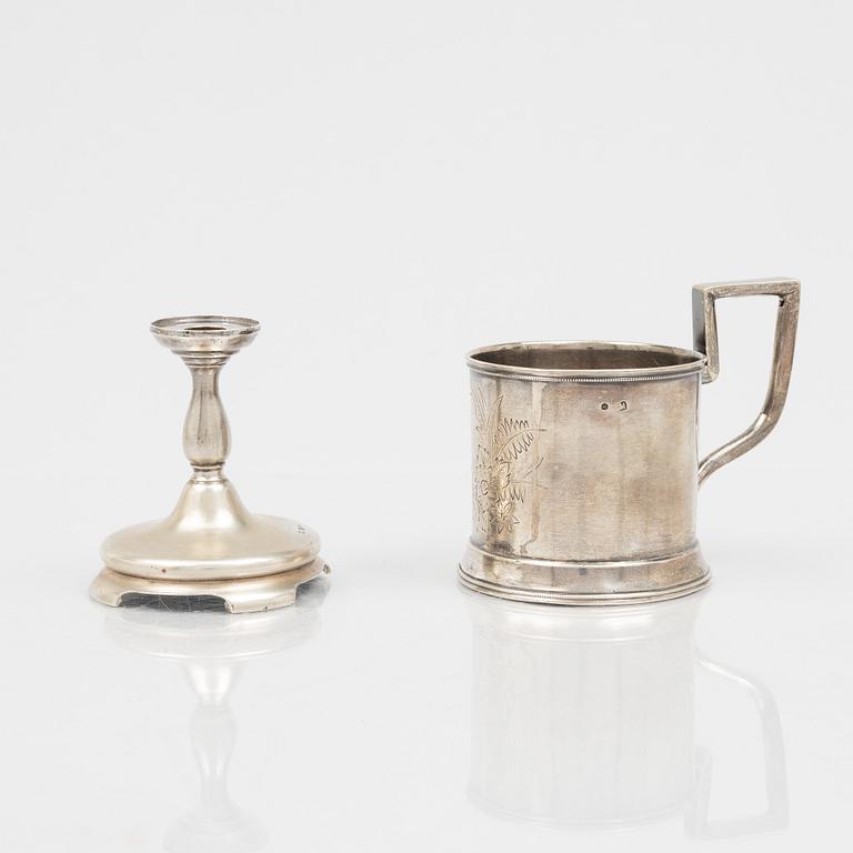 A Russian Silver Candlestick, 1908-26, and a Russian Silver Tea Glass Holder, assay master A. Skovronsky, Moscow 1896.