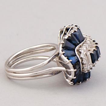 A RING, baguette cut sapphires, brilliant cut diamonds, 14K white gold.