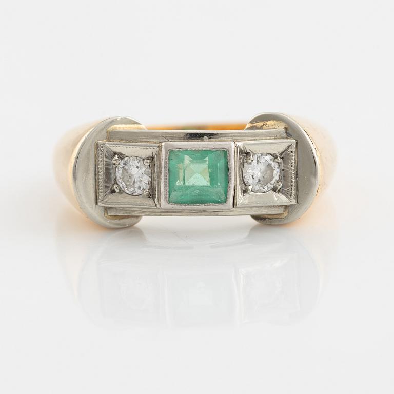 An 18K gold ring set with a step-cut emerald and round brilliant-cut diamonds.
