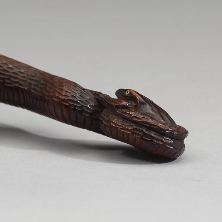 A Japanese bamboo box in the form of a skull with snake, Meiji period (1868-1912).