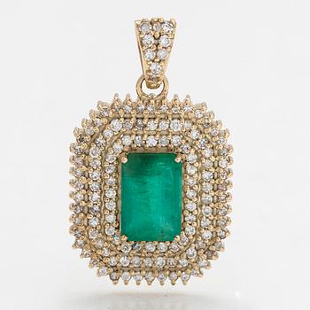 A 14K gold pendant with emerald and brilliant cut diamonds totaling approx. 0.95 ct.
