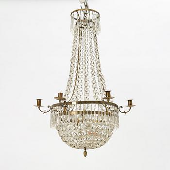 An Empire-style six-branch chandelier, circa 1900.