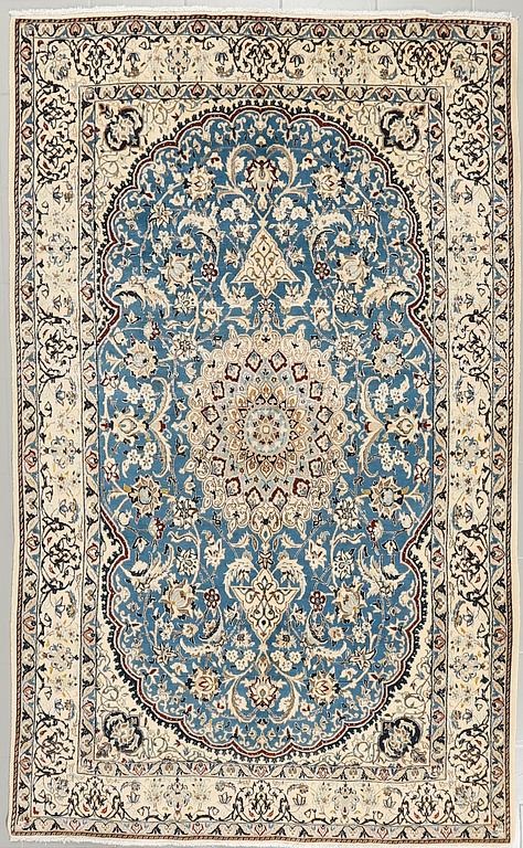 A Nain rug, part silk, 263 x 159 cm.