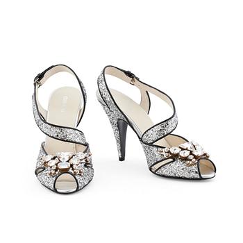 635. MIU MIU, a pair of glitter embellished leather sandals.