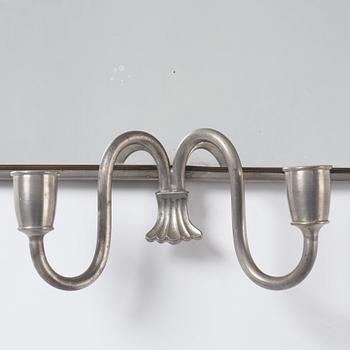 Estrid Ericson, a pewter and brass wall scone for two candles, Svenskt Tenn, Stockholm 1934.