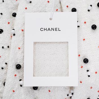 Chanel, a pair of broderie anglais trousers with pearls, size 34.