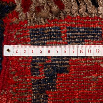 An antique Central Asian carpet, possibly Kirghiz, c. 346 x 154 cm.