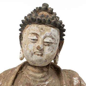 A Southeast Asian figure of a Buddha, 20th century.