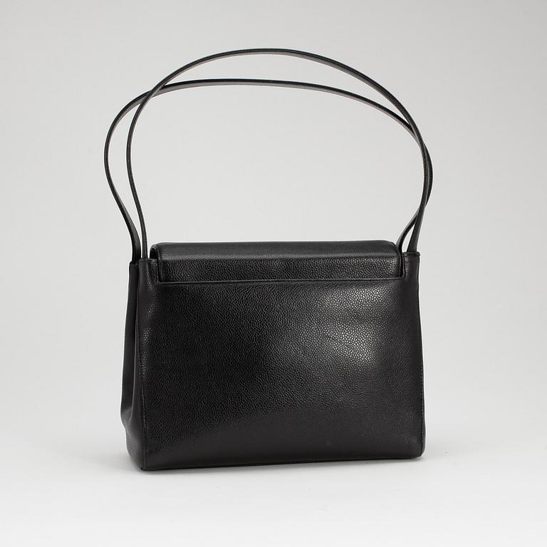 CHANEL, a black caviar leather shoulder bag with gold colored CC lock.