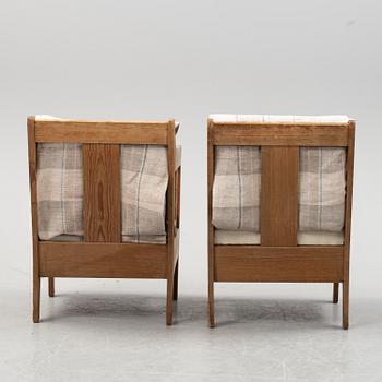 A pair of pine armchairs attributed to Carl Westman, early 20th Century.