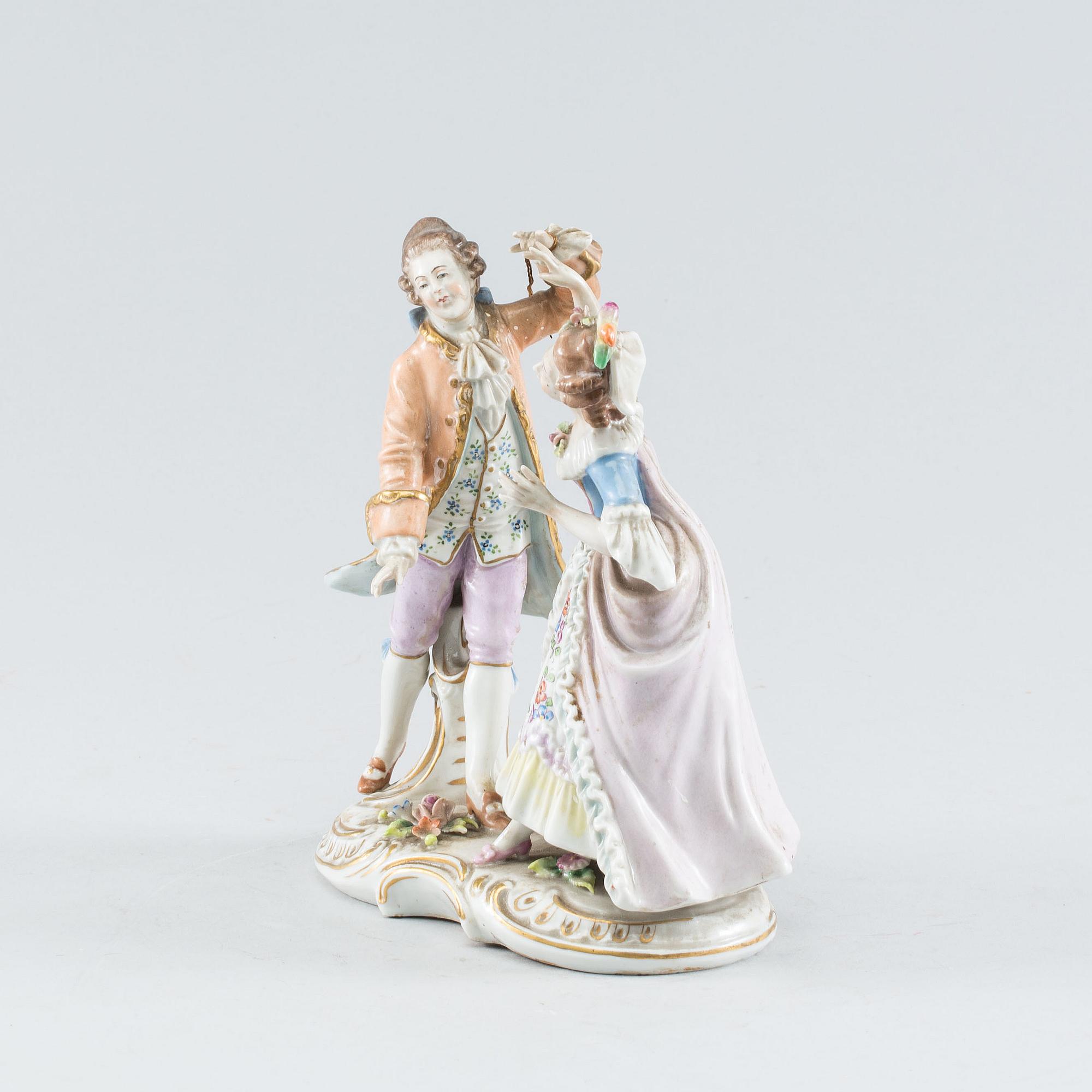 A Rococo style porcelain figure group. First half of the 20th Century.