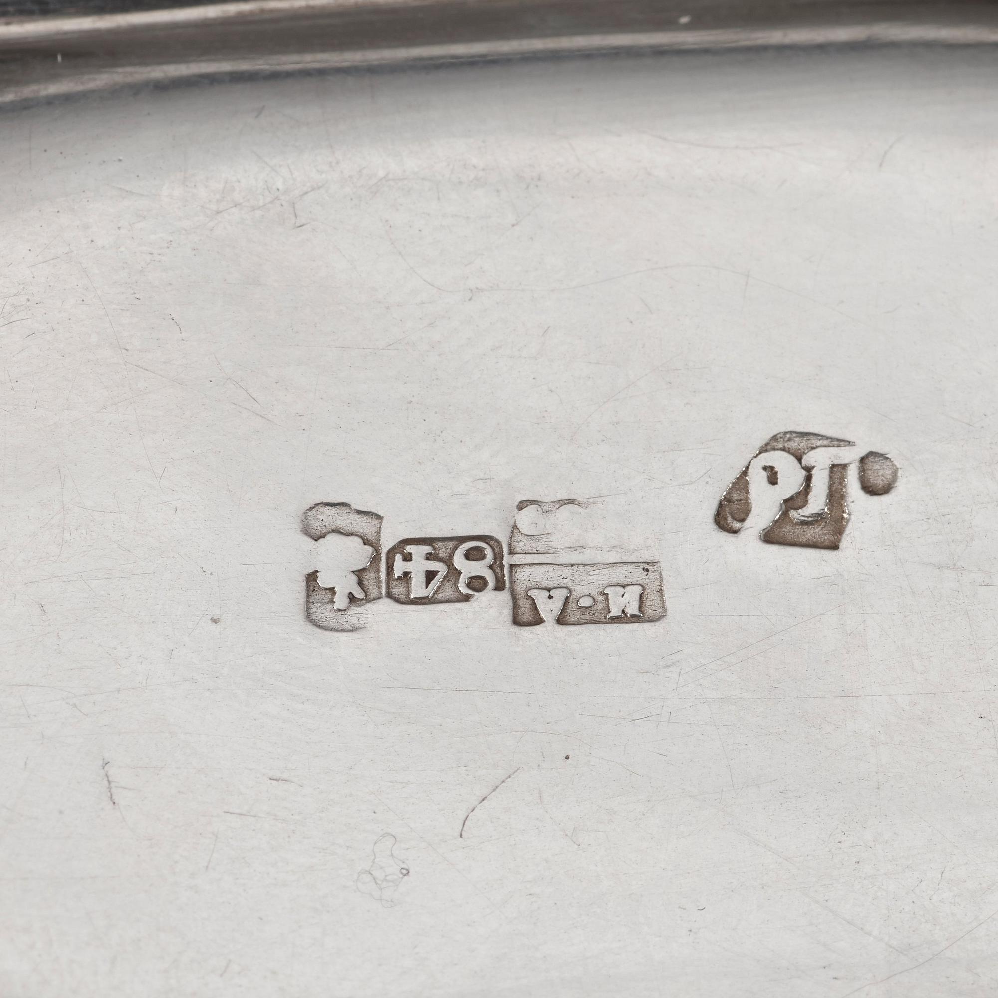 Two Russian mid 19th century parcel-gilt dishes, marked Carl Ekqvist, S:t Petersburg and unidentified maker, Moscow.