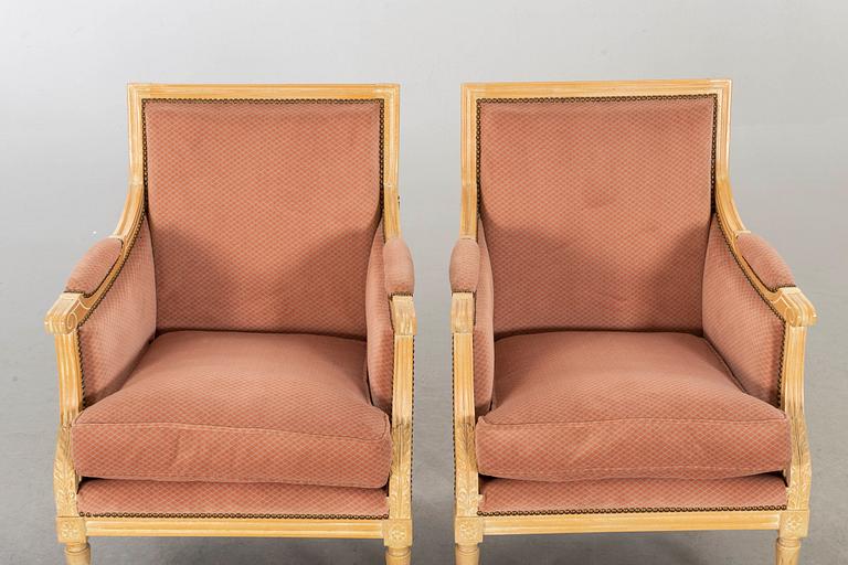 A pair of 20th century gustavian style armchairs.