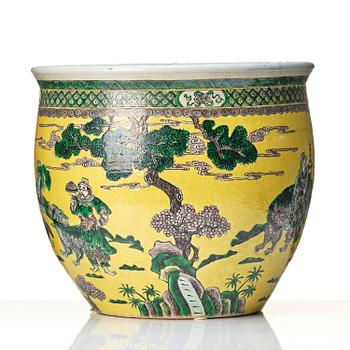 A large yellow ground famille verte bisquit jardiniere, Qing dynasty, 19th century. Marked 'Tack Loong Canton China'.