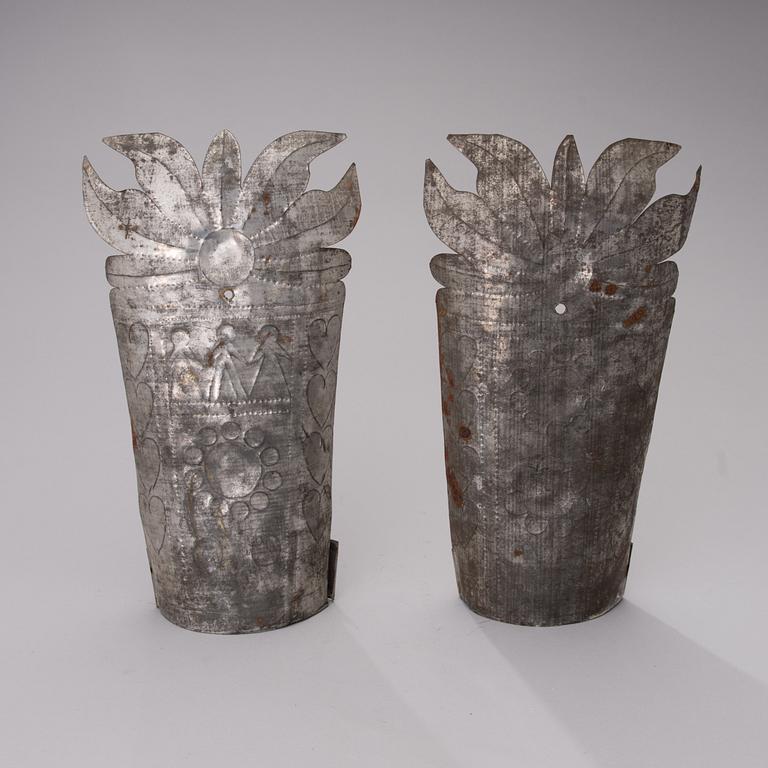A pair of late 19th century tin wall sconces.