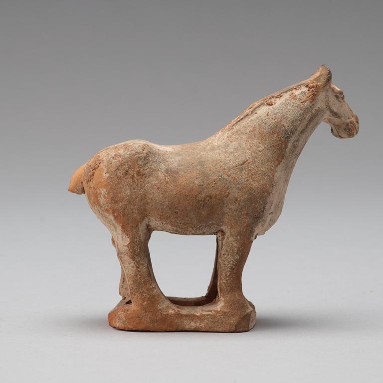 Three pottery scultpures of animals and a herdsman, Tang dynasty (618-906).