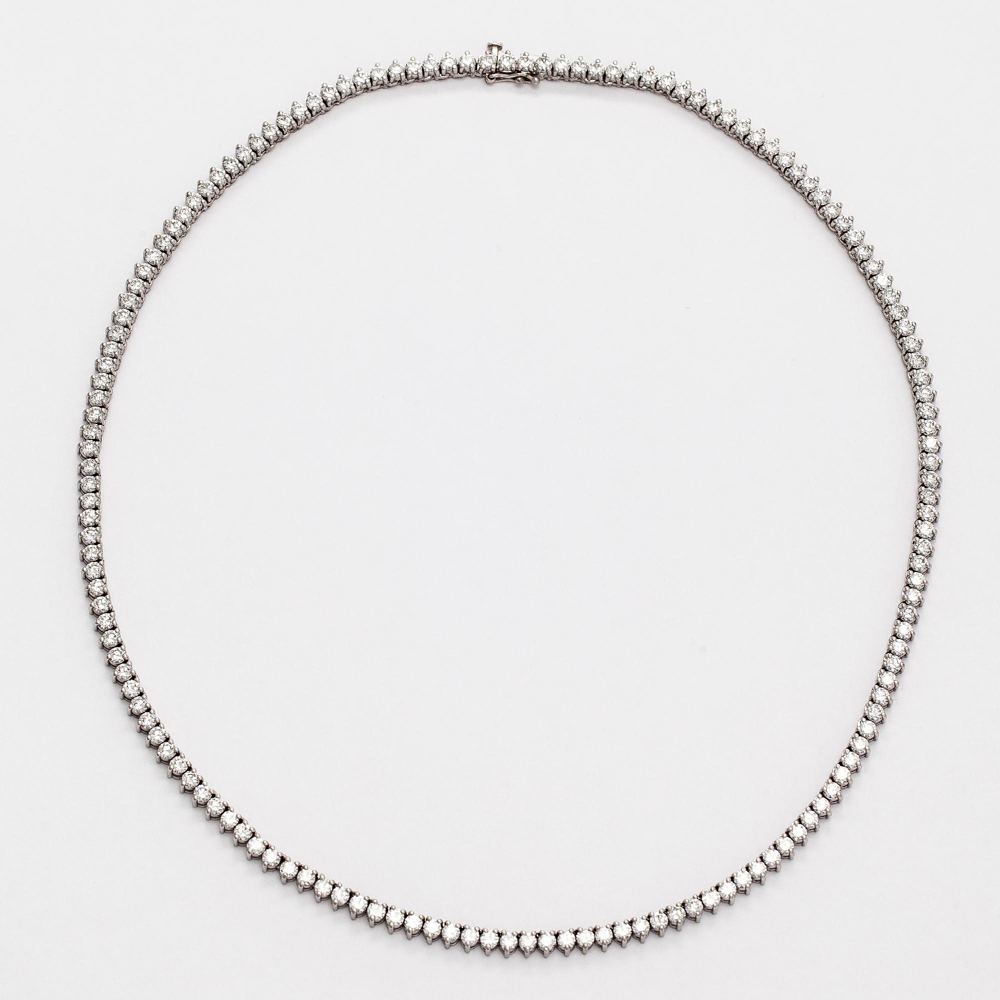 Kaulakoru, 18K valkokultaa ja briljanttihiottuja timantteja.