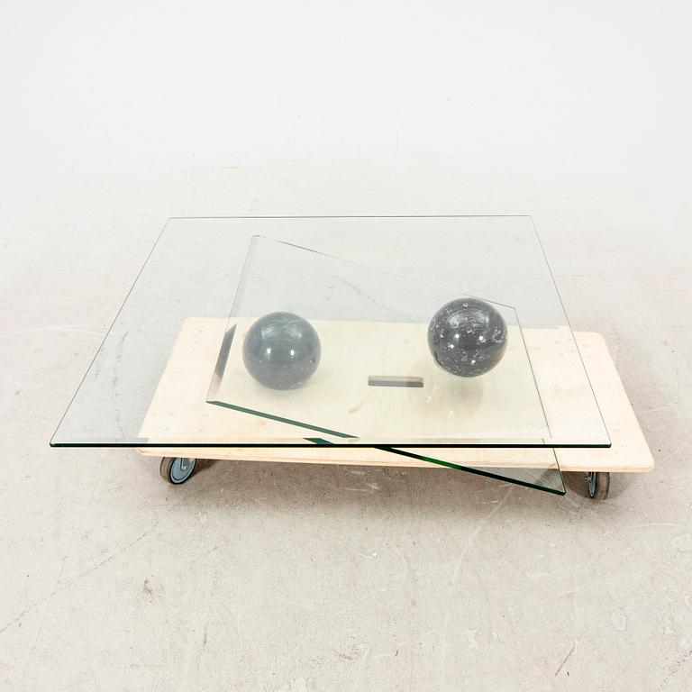 A Roche Bobois glass and marble coffee table alter part of the 20th century.