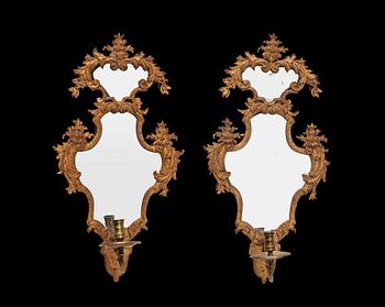 1583. A pair of late Baroque early 18th century girandole mirrors.