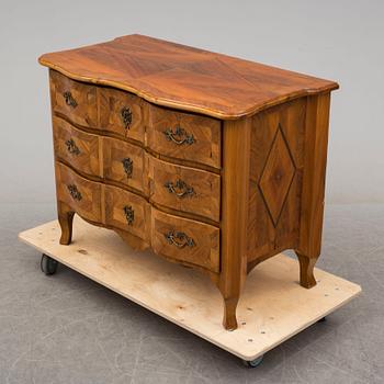 A baroque style chest of drawers circa 1900.