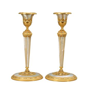 558. A pair of Empire early 19th century candlesticks.