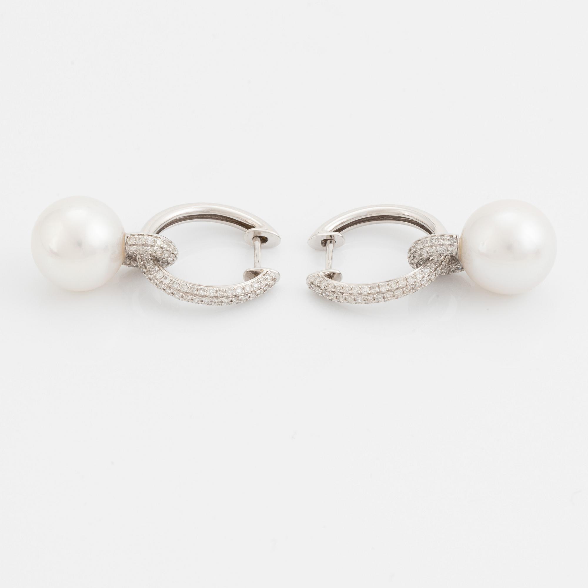 Pearl and brilliant cut diamond earrings.